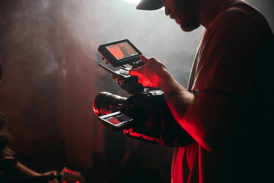 cinematographer adjusting key light on set