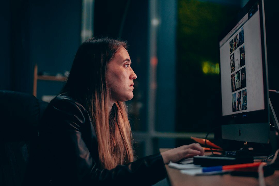 video editor working on computer