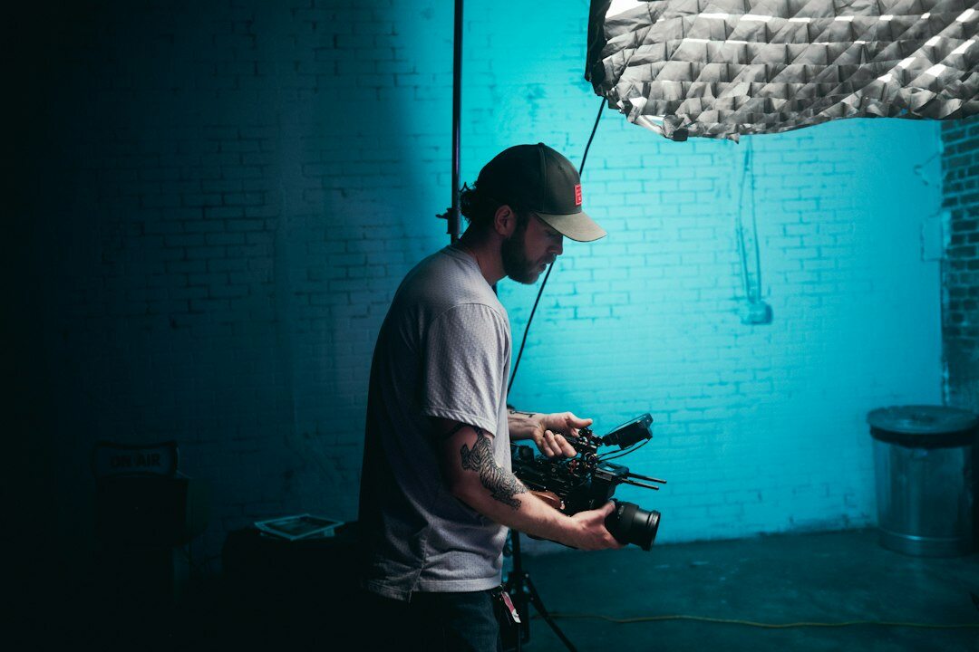 cinematographer adjusting key light on set