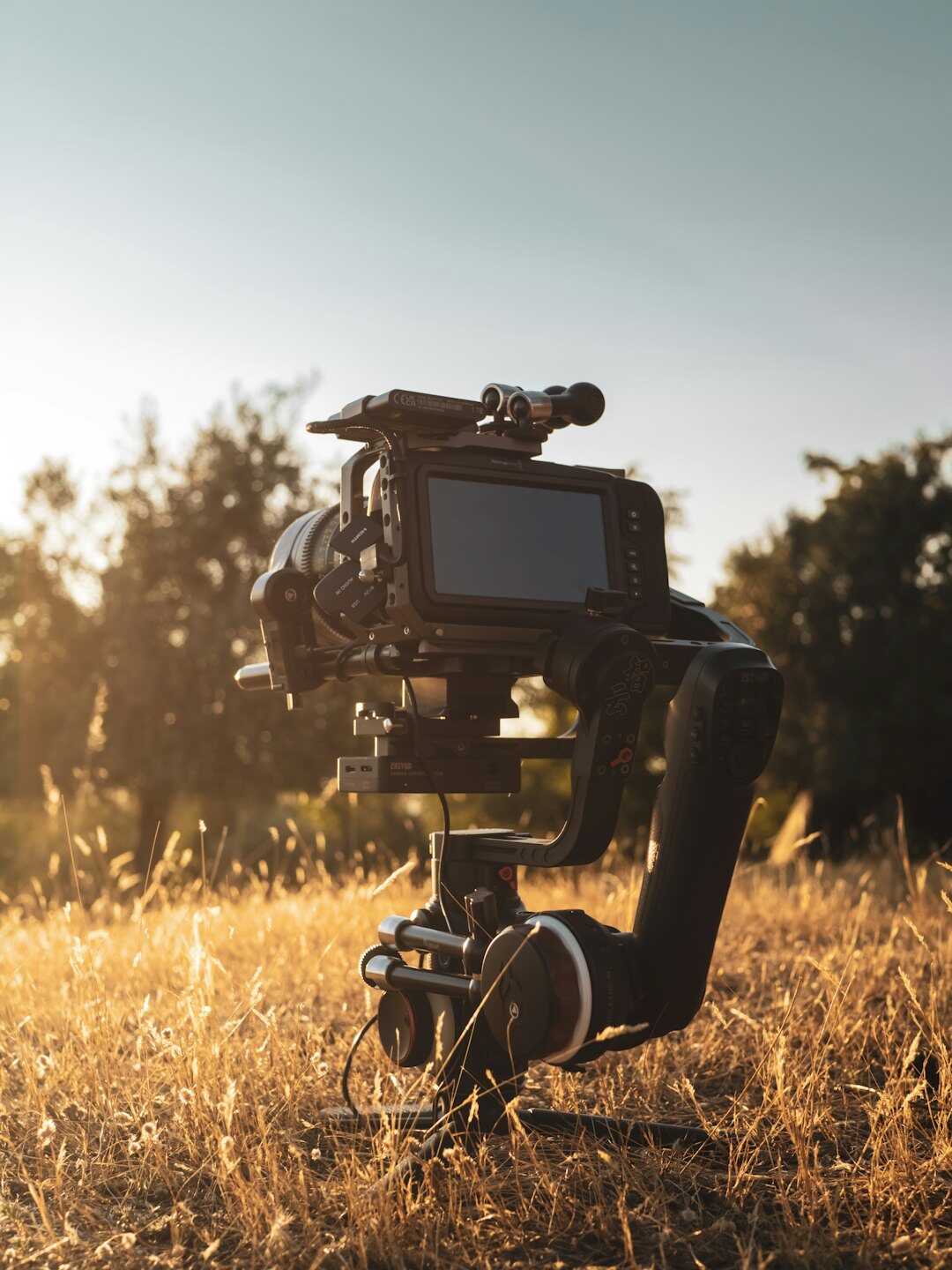 Professional film set with a camera on a tripod, a clapperboard and a lighting rig